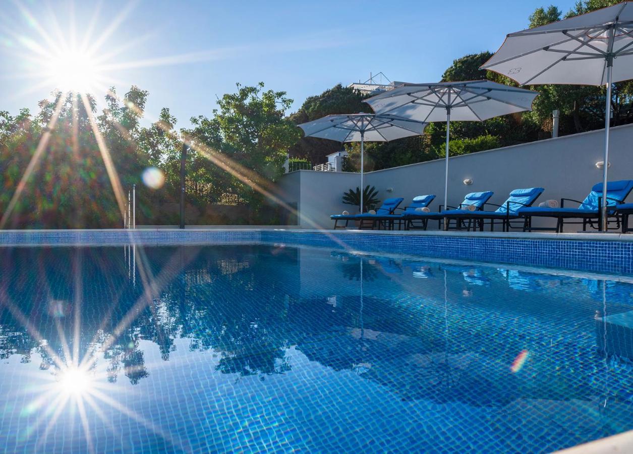 Hotel Sun Gardens Dubrovnik Orasac Esterno foto The swimming pool at the hotel